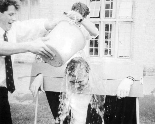 David Pattison being drenched in the stocks by a 6th form pupil